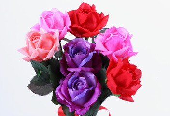 Red, pink and purple colorful textile rose closeup