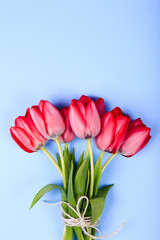 Bouquet of Pink Tulips and ribbon. Easter day background.