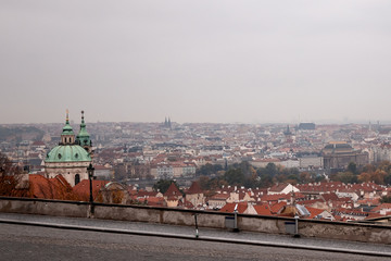 View of the roofs of Prague in cloudy weather