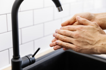 Washing hands under the water tap or faucet without soap. Global Hand washing Day Concept