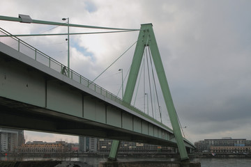 Cable-stayed double-span bridge over river. Cologne, Germany