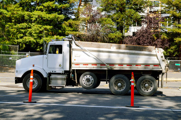 Road works in the city. Big dump truck waiting to be unloaded.