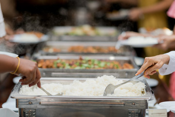 scooping the food, catering, dinner time