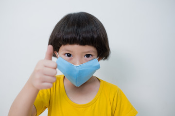  kid wearing mask on white background, protect virus covid-19