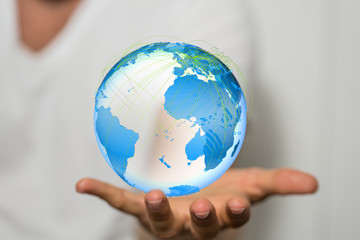 Human Hand Holding The World In Hands.