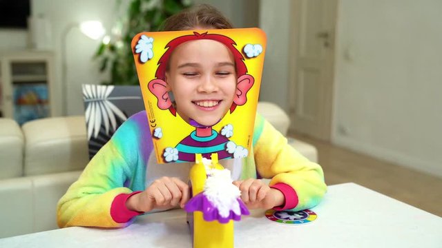 little girl plays pie in the face