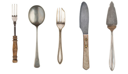 Vintage Silverware, antique spoons, forks, knives, cake shovels isolated on isolated white background. Antique silverware. Retro.