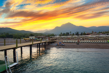 Amazing sunset on the coast of Turkish Riviera with Mount Tahtali in background, Tekirova