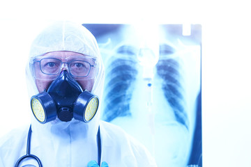  coronavirus or covid-19 concept,Male doctor in a protective suit Giving medicines to patients in the hospital.Lung X-ray Film Destruction Background.shallow focus effect.