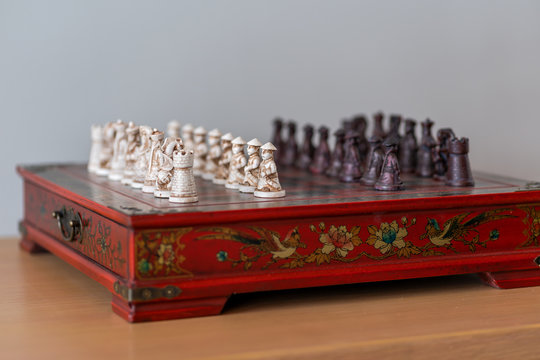 Beautiful army miniature Chinese red chess board game made from small wood carving is strategy board game for two players, Sport that uses the brain and practice meditation well