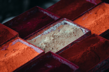 Display of spices in red and orange colors in a market in Kathmandu, Nepal