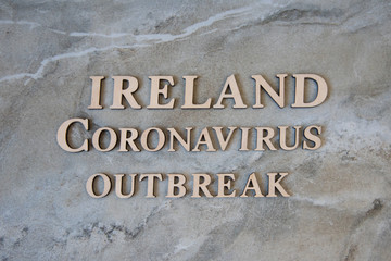 IRELAND coronavirus outbreak word written on wooden letters.