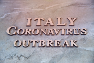 Italy coronavirus outbreak word written on wooden letters.