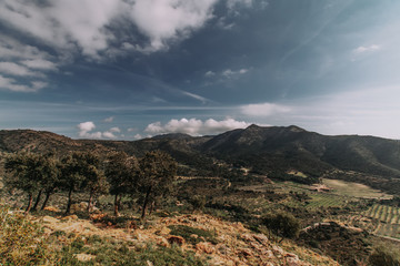 Fototapeta na wymiar Landscape with mountain peaks in sunset, grape yards in valley, Spanish Pyrenees, Catalonia . Exotic destinations concept.