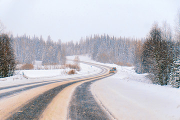 Obraz premium Winter road in Snow Forest in Cold Finland in Lapland