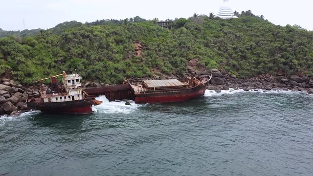 The rusty shipwreck run aground. Sri Lanka