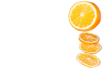 Oranges and cinnamon in a glass jar close up isolated on a white background. Macro view of chopped fruits