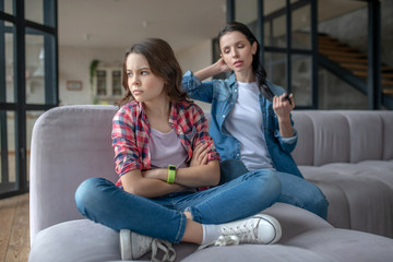 Girl in a checkered shirt looking agressive