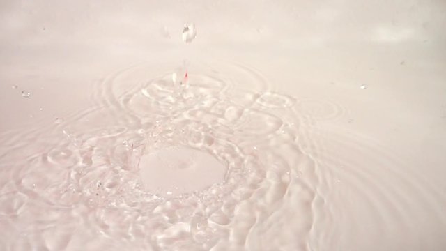 The fall of juicy radish into the water. Slow motion.