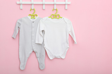 Baby clothes on a hanger. Place for text, minimalism.