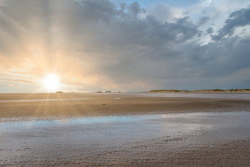 Beach of St Peter-Ording with stilt houses in the background