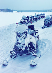 Snowmobiles on frozen lake in winter Rovaniemi