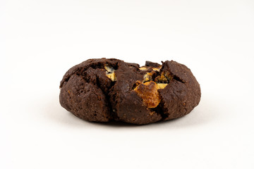 A cookie cake with chocolate on white background with copy space - angled view