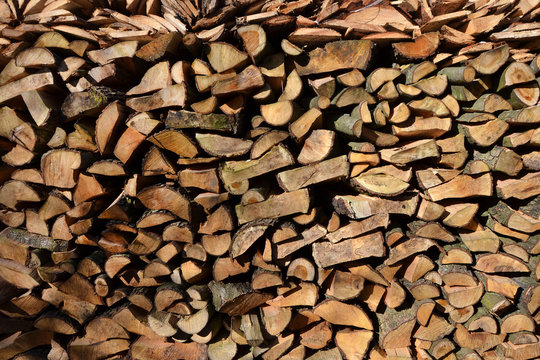 many chopped firewood natural background
