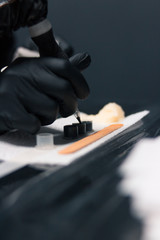 Tattoo artist preparing ink