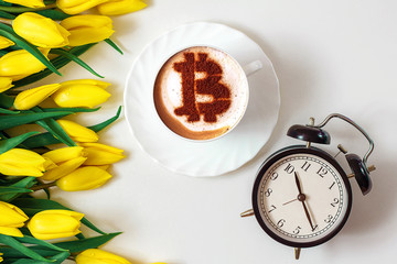 coffee cappuccino in a white cup with a symbol Bitcoin