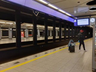Amsterdam train station empty at night without transportation due to the coronavirus danger