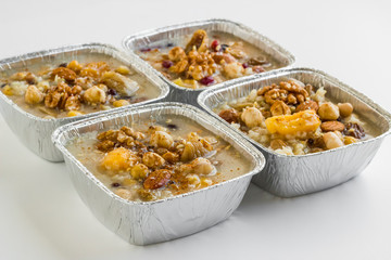Traditional Dessert Asure,Noah's Pudding in foil container -take away package-at the white surface.
