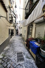 Narrow and colorful streets of Lisbon in a cloudy day