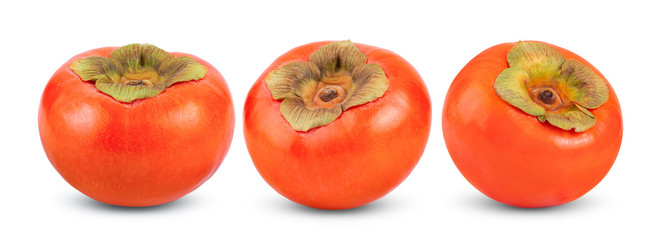 ripe persimmons with leaf on white background. full depth of field