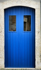 Colorful blue metal door in Lisbon
