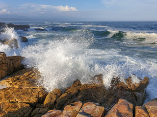 Turbulent sea crashing onto rocks.