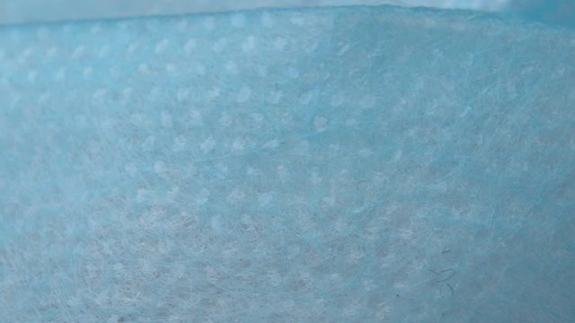 Blue medical surgery facemask texture. Fabrics background