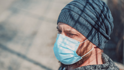 Close Up Portrait Of A Hipster Man In A Medical Mask For Protection Against Flu Virus Or Coronavirus Outdoor. Corona Virus Pandemic. Epidemic Viral Respiratory Syndrome. 2019-nCoV. High Quality Photo