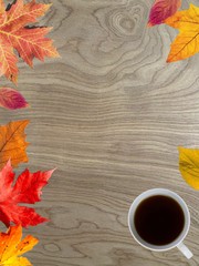 Fototapeta na wymiar autumn background with leaves and cup of coffee
