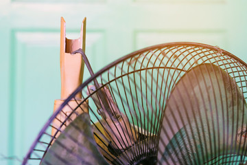 Close up to the old plastic joints of the electronic fan damaged and broken with a blurred background. Selective focus