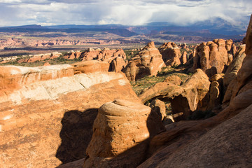 The desert countryside of Arches NP with rock formations.