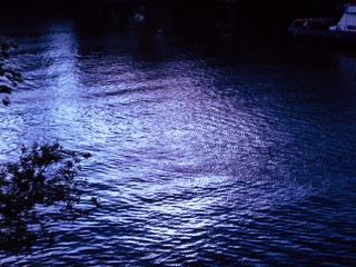 dark blue river during calm evening summer