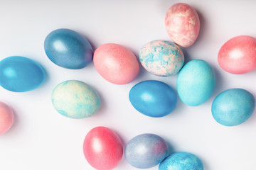 Fototapeta na wymiar Pink and blue easter eggs on a white background.