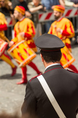 carabiniere watches over a typical parade in Umbria