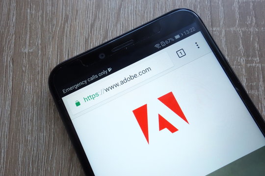 KONSKIE, POLAND - JULY 21, 2018: Adobe company website displayed on a modern smartphone