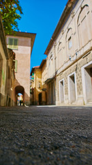Empty Street in the Italian town Fossano in Province Cuneo, Region Piedmont, northern Italy.
