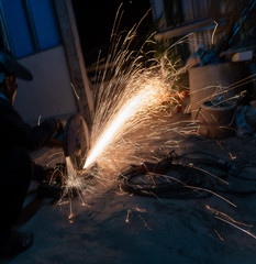 Cutting metal with cutting machine.