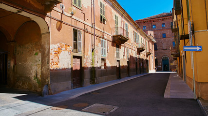 Fototapeta na wymiar Empty Street in the Italian town Fossano in Province Cuneo, Region Piedmont, northern Italy.