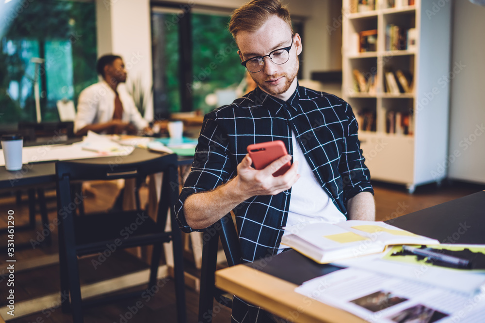 Poster caucasian millennial blogger reading comments on personal website page during time for knowledge stu