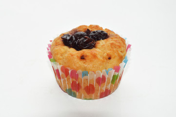 Bun with a cherry. Fresh homemade cakes. Delicious cake.